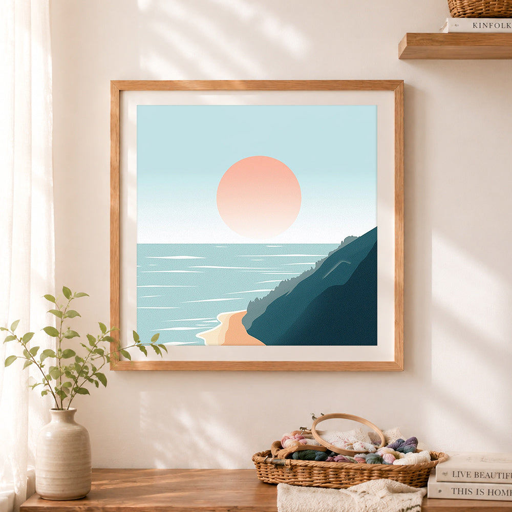 Finished pastel ocean cliff dusk cross stitch artwork displayed as home decor