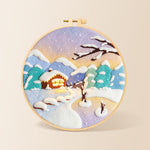 Pastel twilight snowy cabin needle felting kit for beginners with a round wooden frame