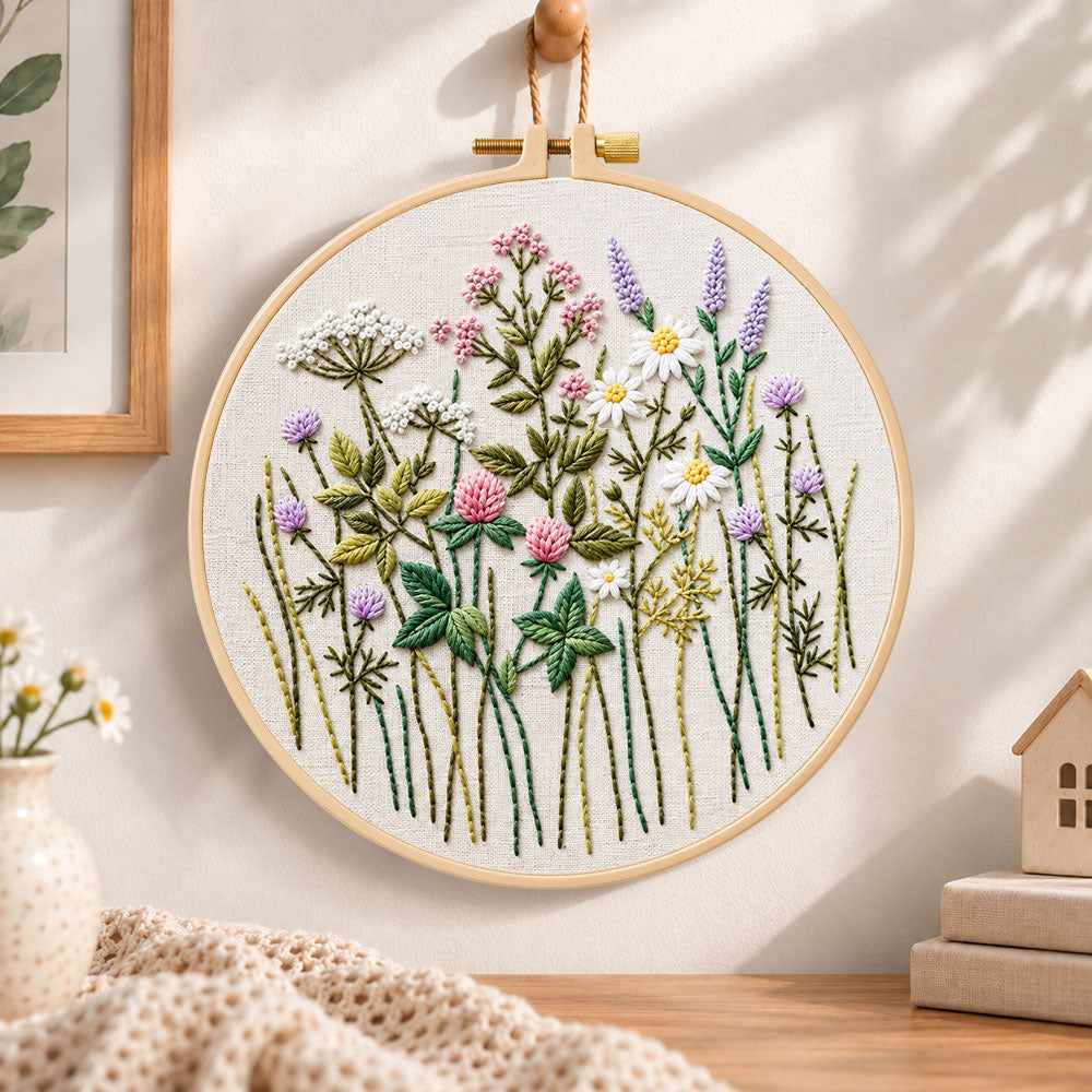 Pastel wildflower hand embroidery hoop wall art displayed as warm and cozy handmade home decor