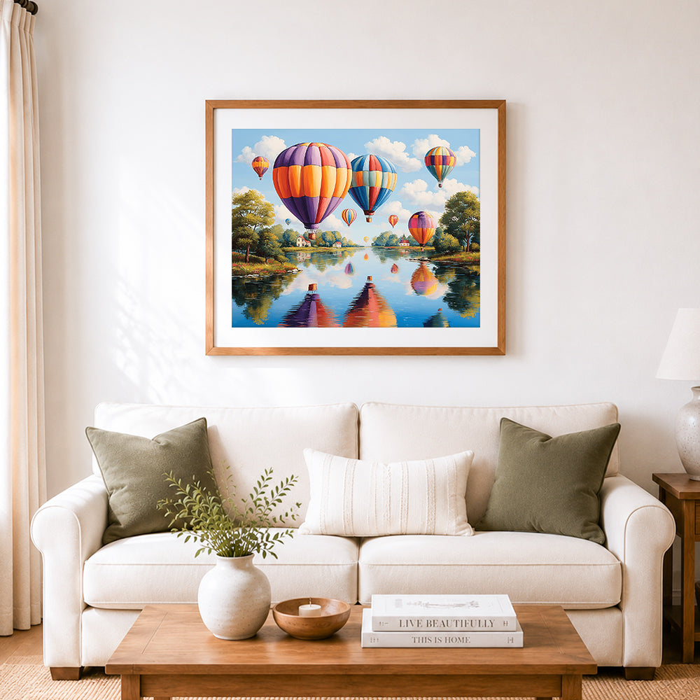 Finished pastoral river balloon ride cross stitch artwork displayed as home decor