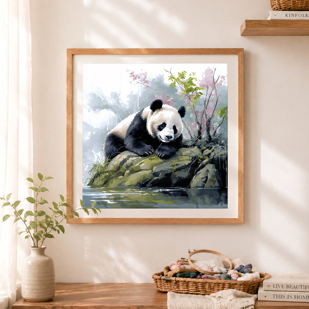 Finished peaceful riverside panda cross stitch artwork displayed as home decor