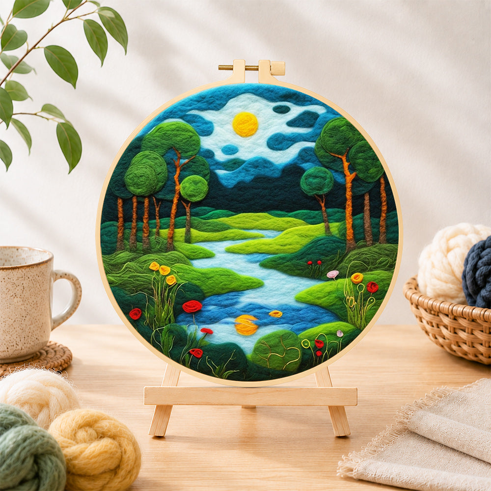 Finished peaceful woodland river needle felting displayed on a wooden easel