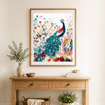 Finished peacock in wild floral garden cross stitch artwork displayed as home decor