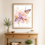 Finished peony with butterfly cross stitch artwork displayed as home decor