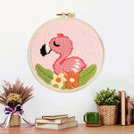 Finished pink baby flamingo artwork displayed on a wall