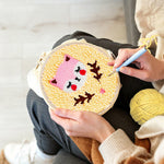 Creating handmade pink baby fox punch needle artwork