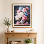 Finished pink blue and white peonies in vase cross stitch artwork displayed as home decor