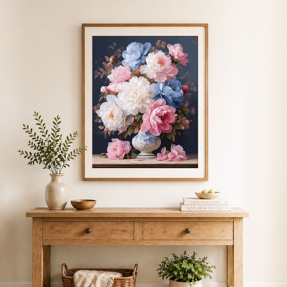 Finished pink blue and white peonies in vase cross stitch artwork displayed as home decor