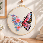 Pink butterfly with peony embroidery hoop wall art displayed as warm and cozy handmade home decor