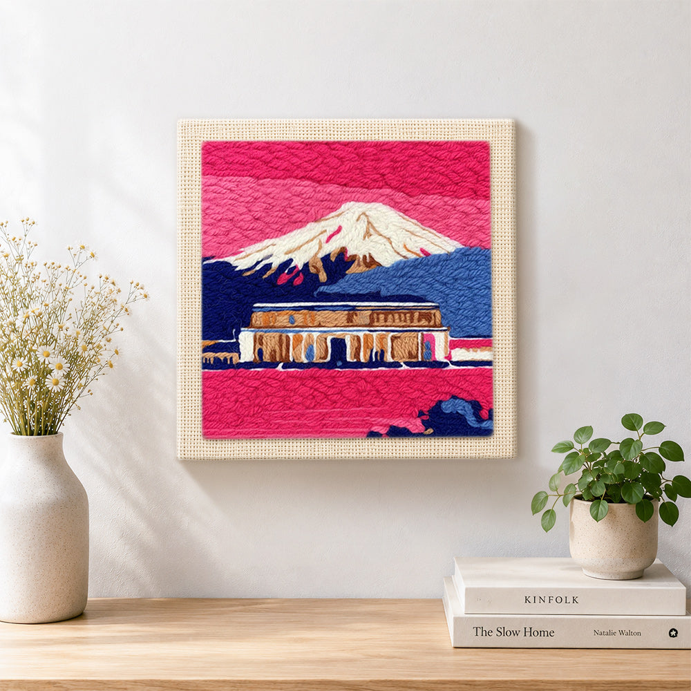 Finished pink dusk temple and snowy mountain artwork displayed on a wall