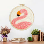 Finished pink flamingo artwork displayed on a wall