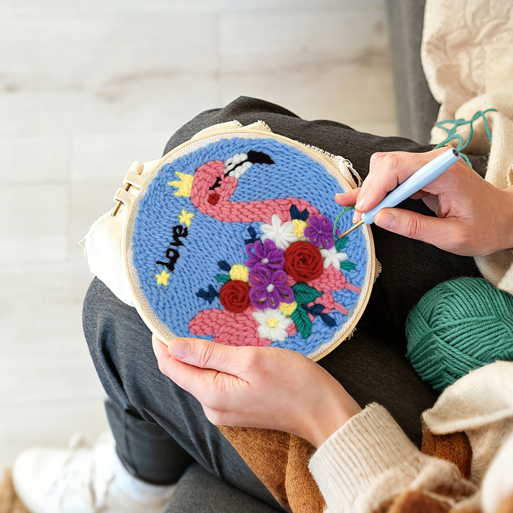 Creating handmade pink flamingo with colorful flowers punch needle artwork