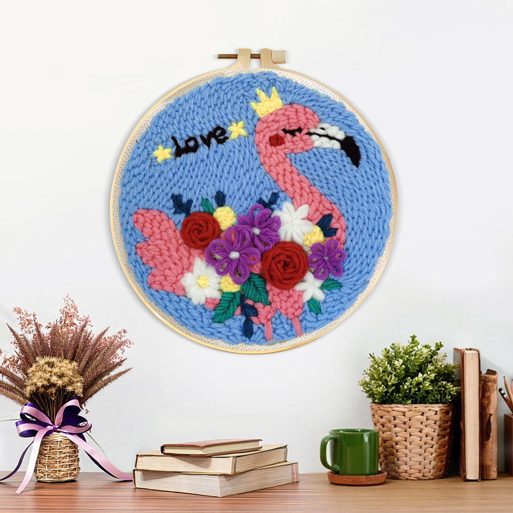 Finished pink flamingo with colorful flowers artwork displayed on a wall