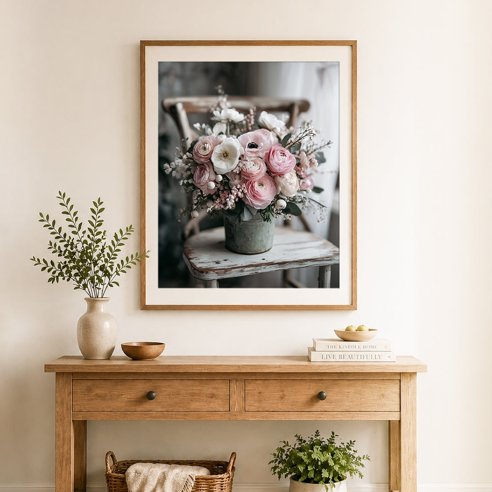 Finished pink floral arrangement on wooden chair cross stitch artwork displayed as home decor