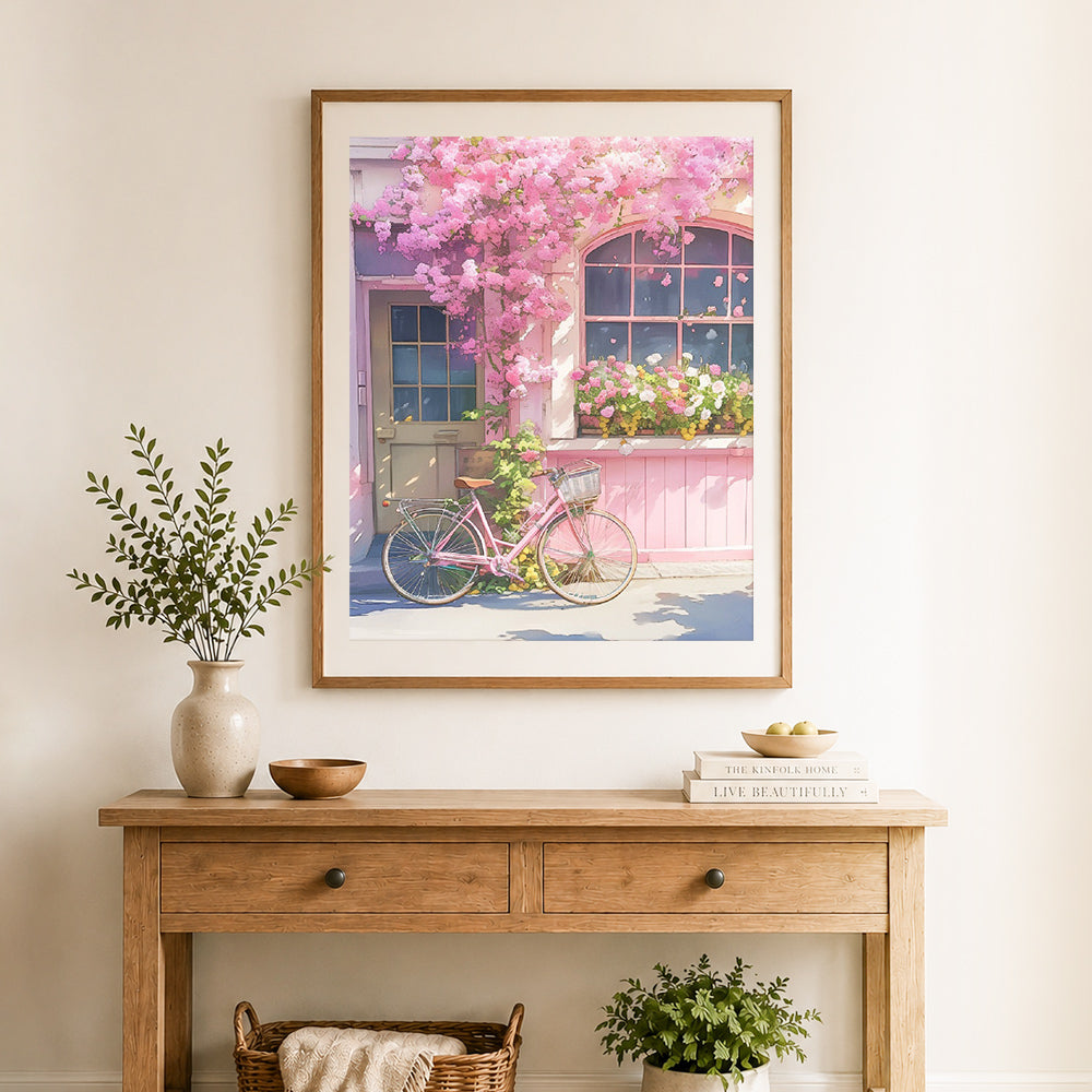 Finished pink floral cottage cross stitch artwork displayed as home decor