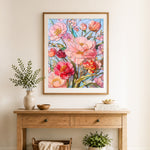 Finished pink flowers stained glass style cross stitch artwork displayed as home decor