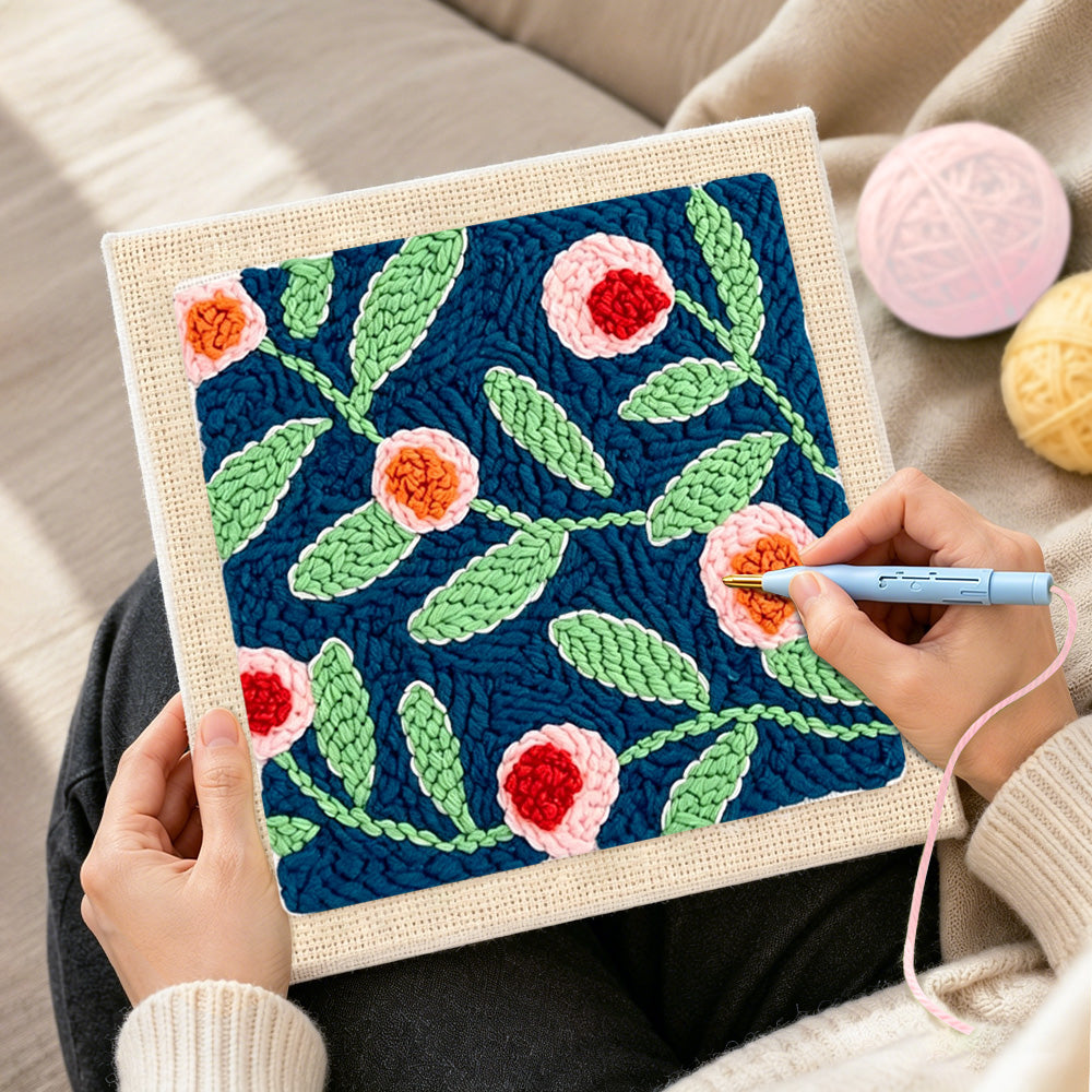 Creating handmade pink flowers with green leaves punch needle artwork
