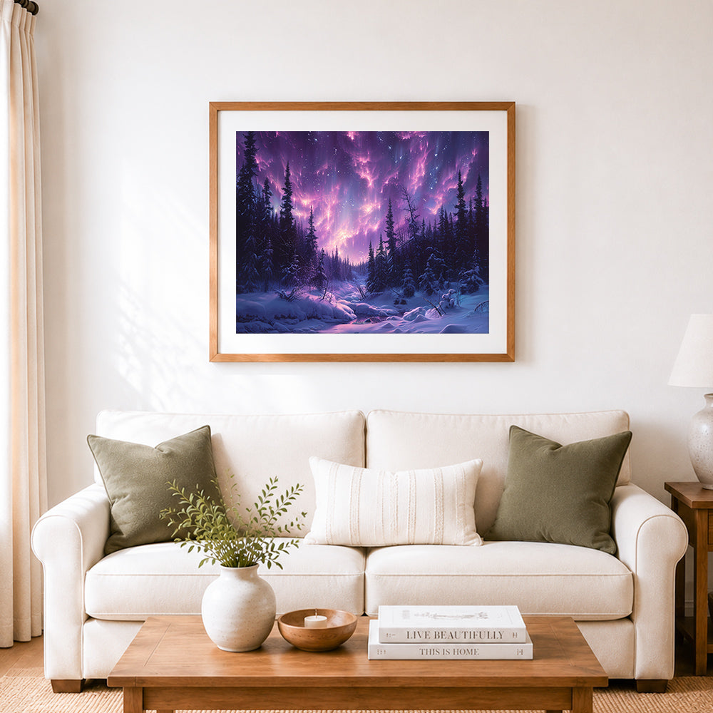 Finished pink northern lights over snowy forest cross stitch artwork displayed as home decor