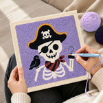 Creating handmade pirate skeleton punch needle artwork