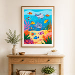 Finished playful ocean creature party cross stitch artwork displayed as home decor