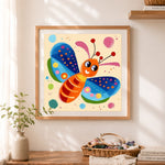 Finished playful smiling butterfly cross stitch artwork displayed as home decor