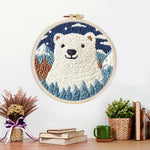 Finished polar bear in mountain forest artwork displayed on a wall