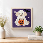 Finished poodle ghost trick or treat artwork displayed on a wall
