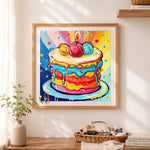 Finished pop‑art birthday cake cross stitch artwork displayed as home decor