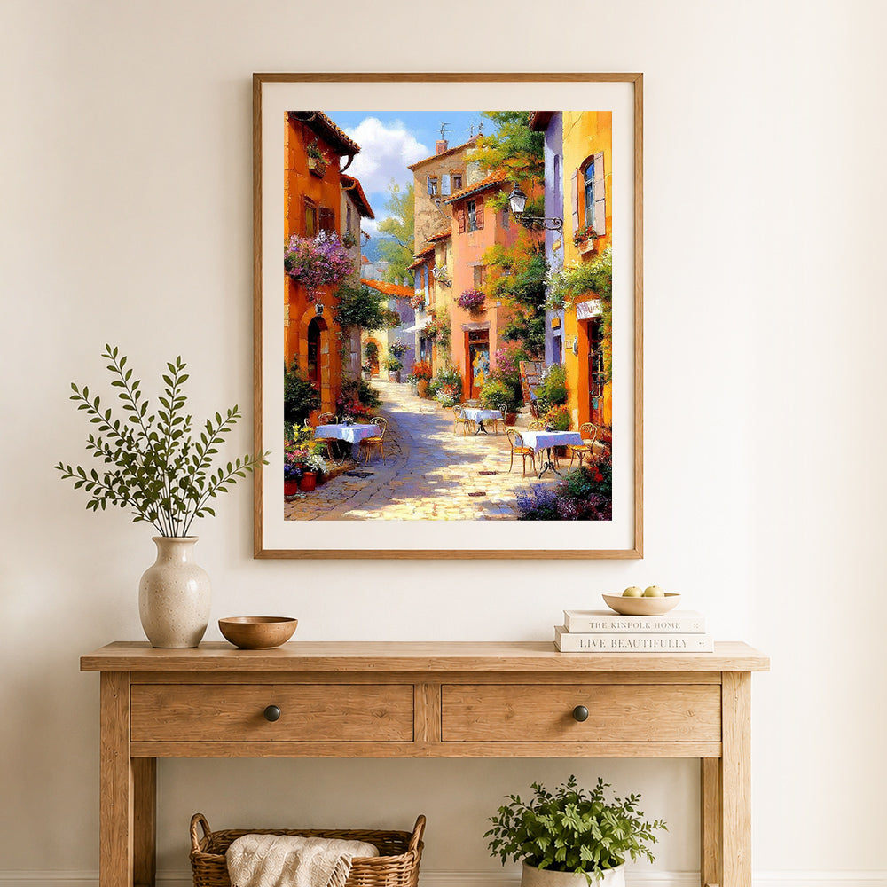 Finished provence street morning cross stitch artwork displayed as home decor