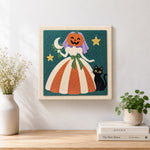 Finished pumpkin bride with black cat artwork displayed on a wall