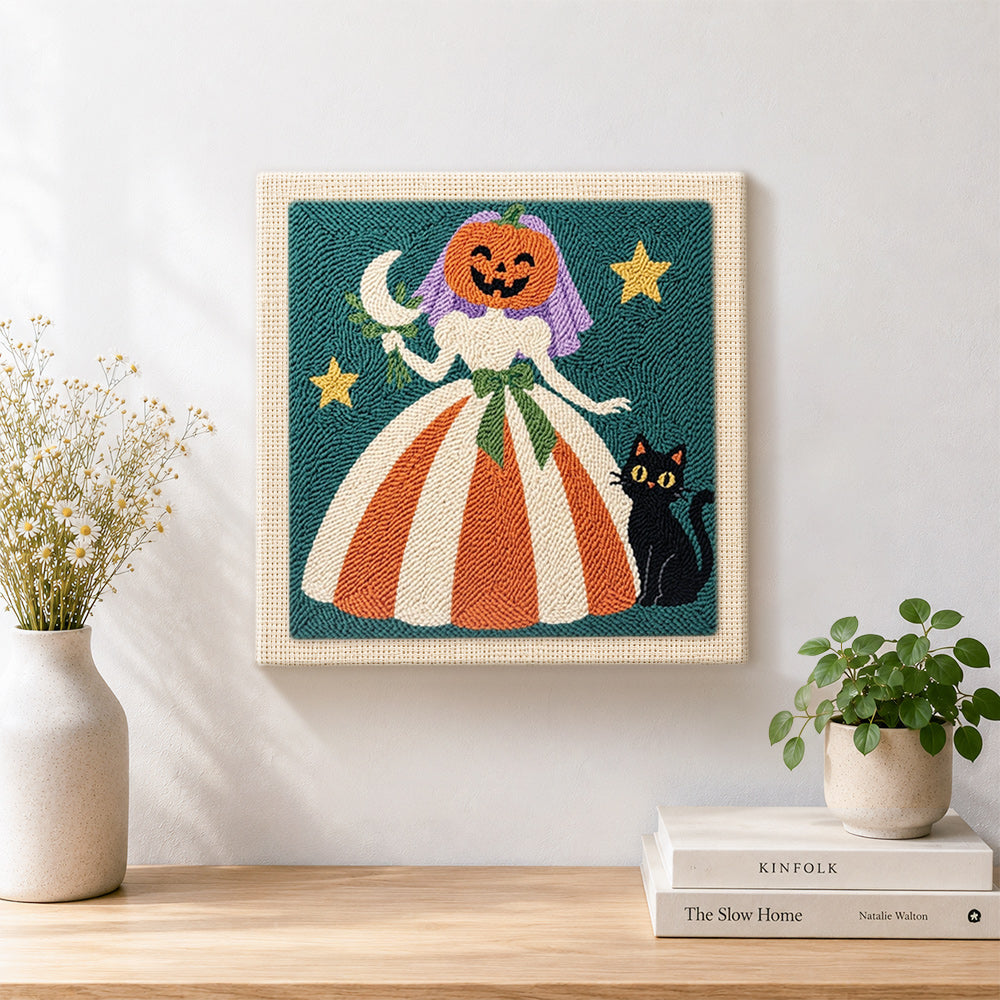 Finished pumpkin bride with black cat artwork displayed on a wall