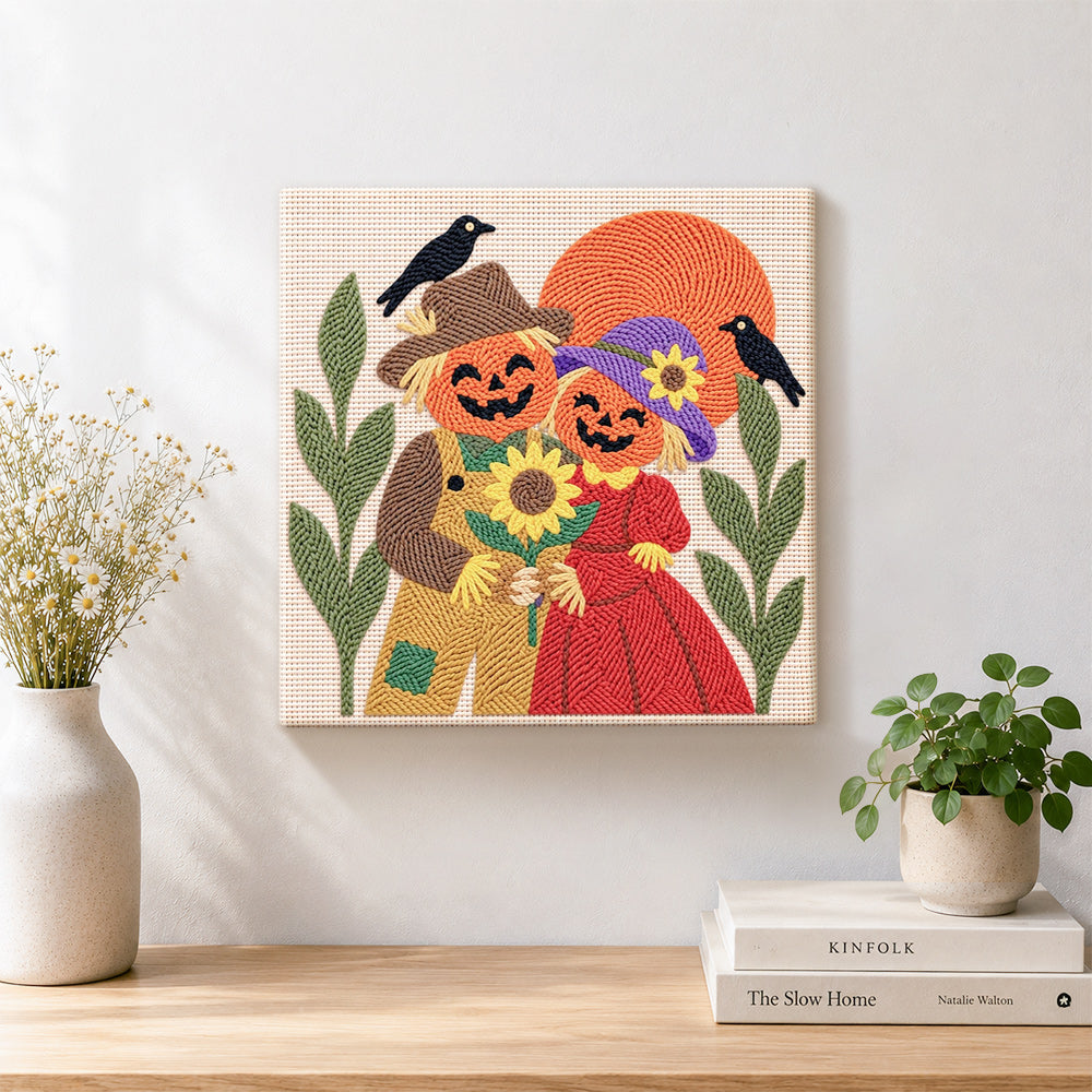 Finished pumpkin couple with sunflower artwork displayed on a wall