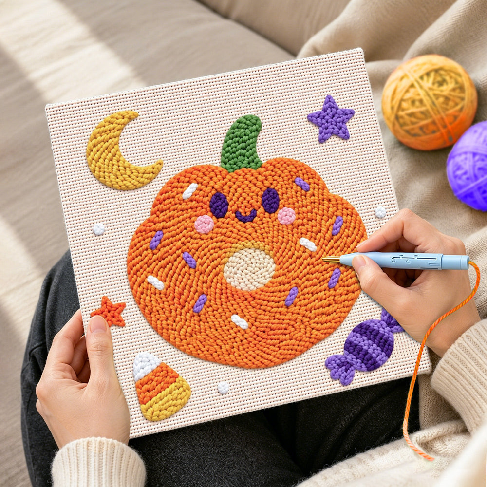 Creating handmade pumpkin donut treat punch needle artwork