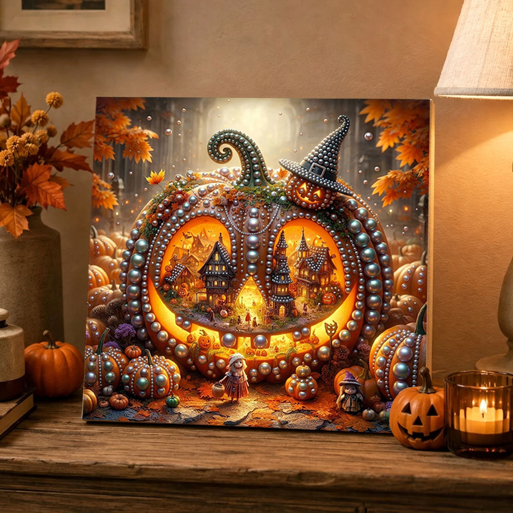 Finished pumpkin fairyland scene pearl diamond painting artwork displayed as holiday home decor
