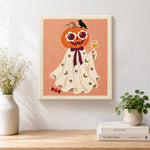 Finished pumpkin ghost with wine glass artwork displayed on a wall