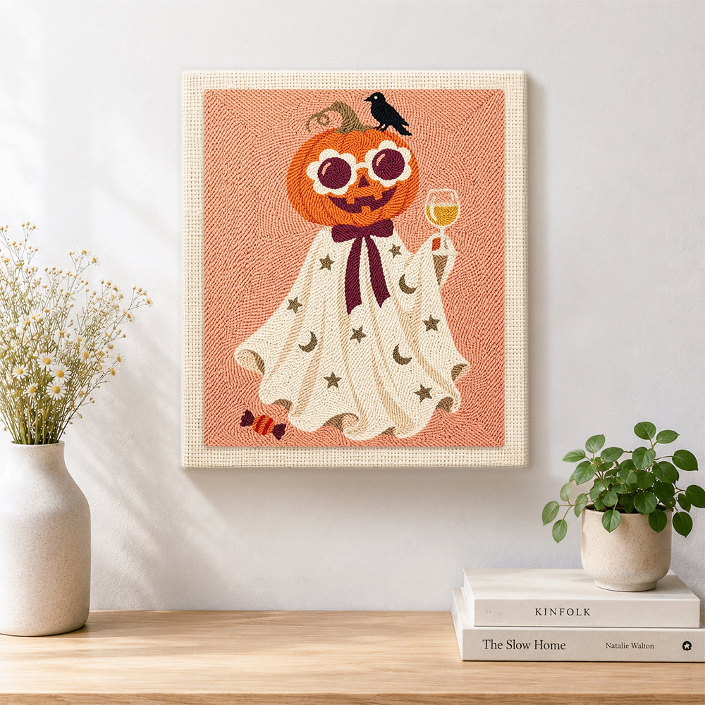 Finished pumpkin ghost with wine glass artwork displayed on a wall