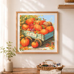 Finished pumpkin harvest wagon cross stitch artwork displayed as home decor