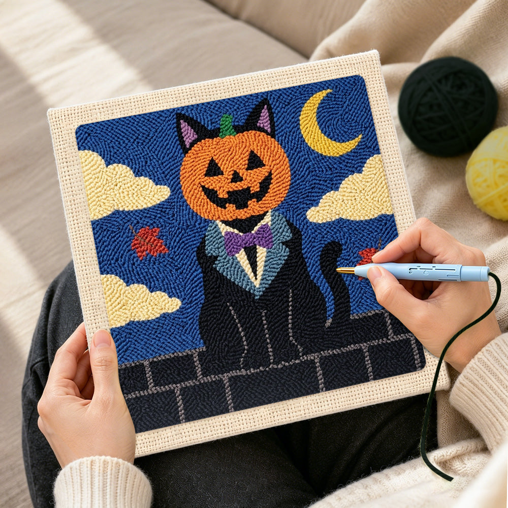 Creating handmade pumpkin‑headed black cat punch needle artwork