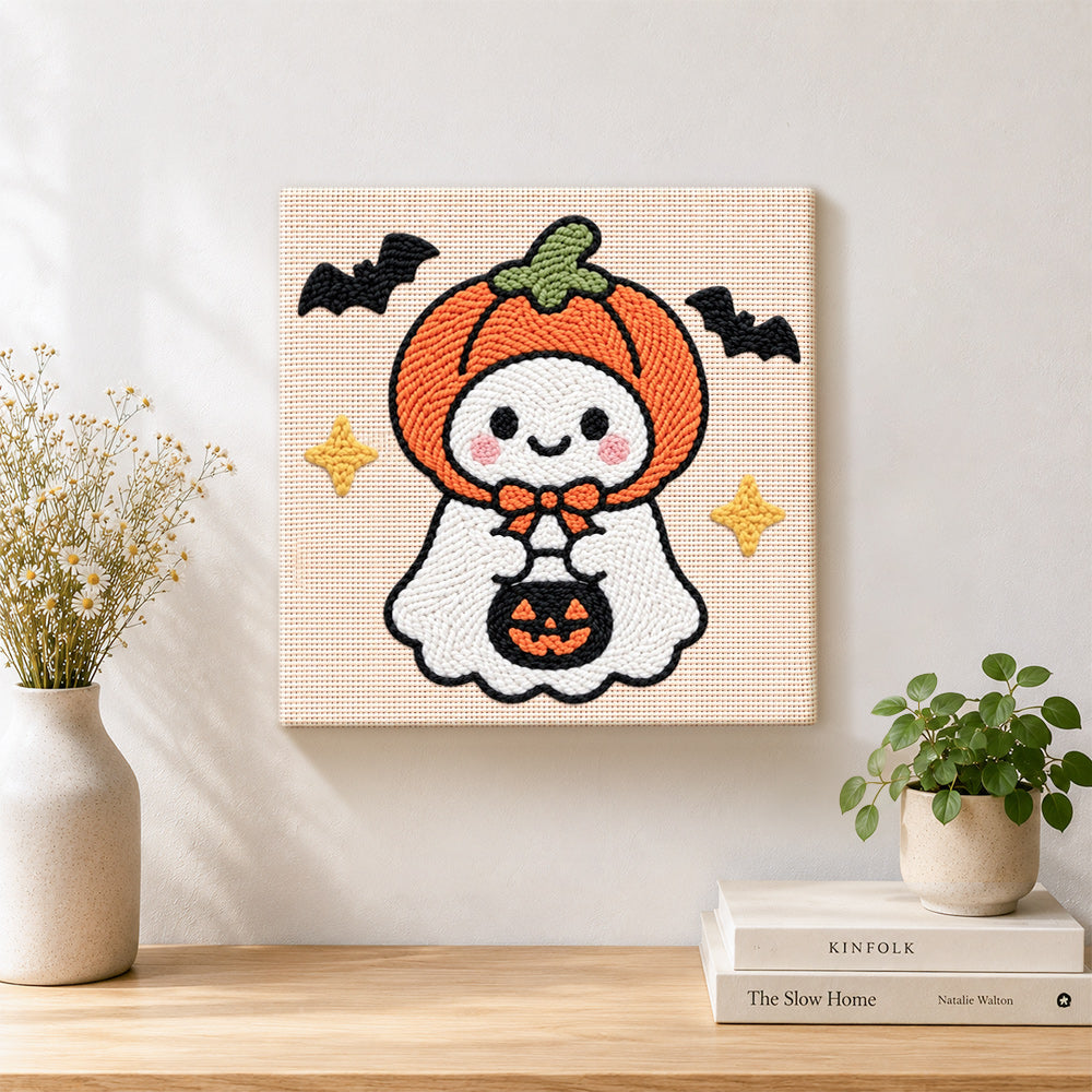 Finished pumpkin hooded ghost artwork displayed on a wall
