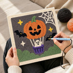 Creating handmade pumpkin hot air balloon punch needle artwork