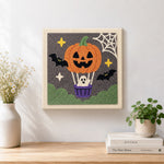 Finished pumpkin hot air balloon artwork displayed on a wall