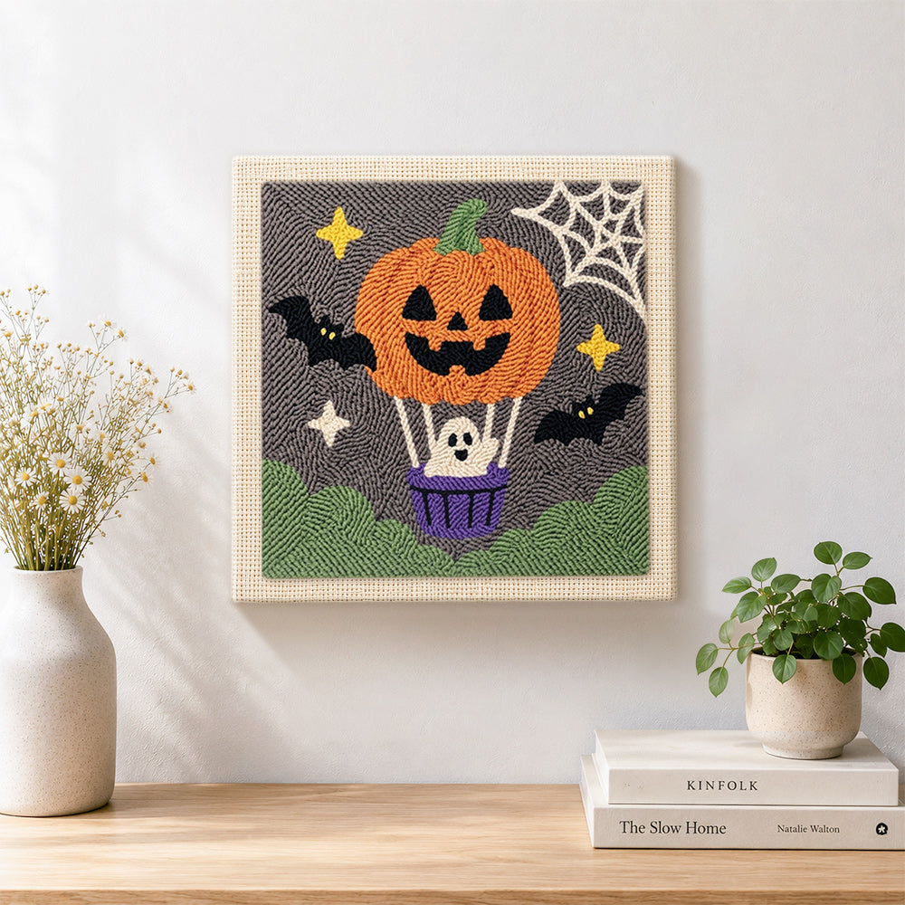 Finished pumpkin hot air balloon artwork displayed on a wall