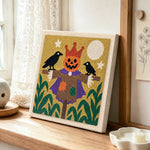 Pumpkin king scarecrow punch needle artwork displayed on a table