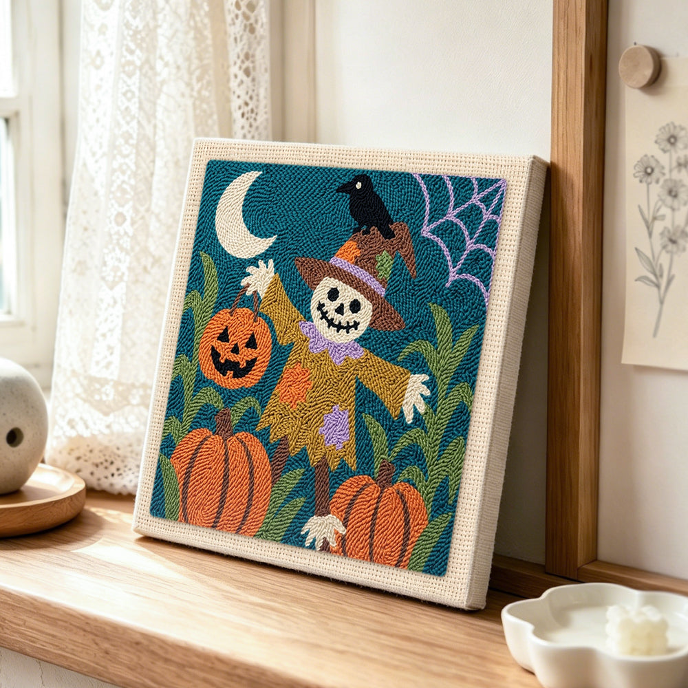 Pumpkin patch scarecrow punch needle artwork displayed on a table
