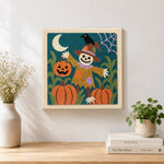 Finished pumpkin patch scarecrow artwork displayed on a wall