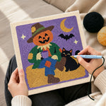 Creating handmade pumpkin scarecrow punch needle artwork