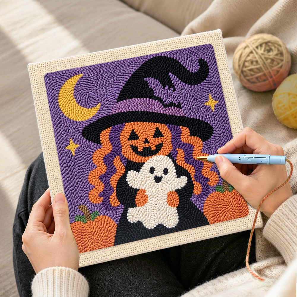 Creating handmade pumpkin witch holding little ghost punch needle artwork