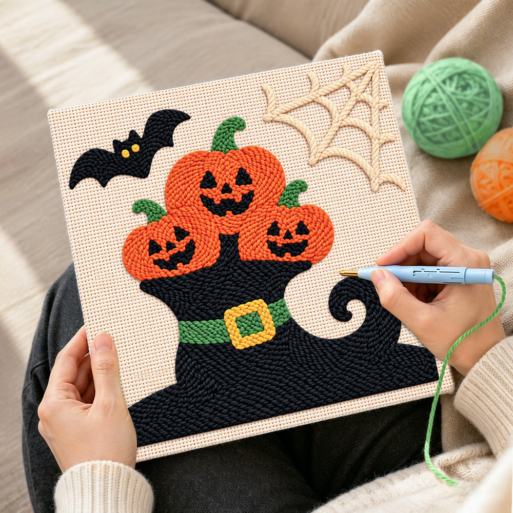 Creating handmade pumpkins on witch hat punch needle artwork