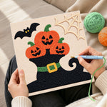 Creating handmade pumpkins on witch hat punch needle artwork