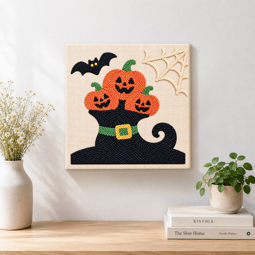 Finished pumpkins on witch hat artwork displayed on a wall